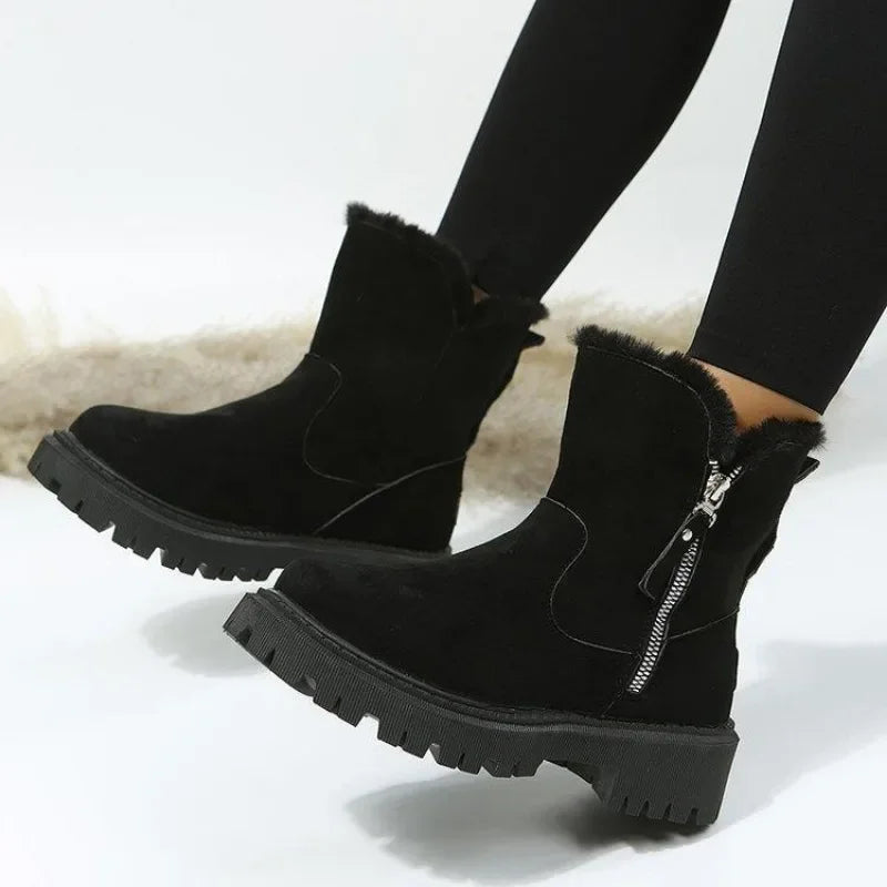 Women's cold-weather boots: ankle height, fur-lined interior, and practical side zipper.