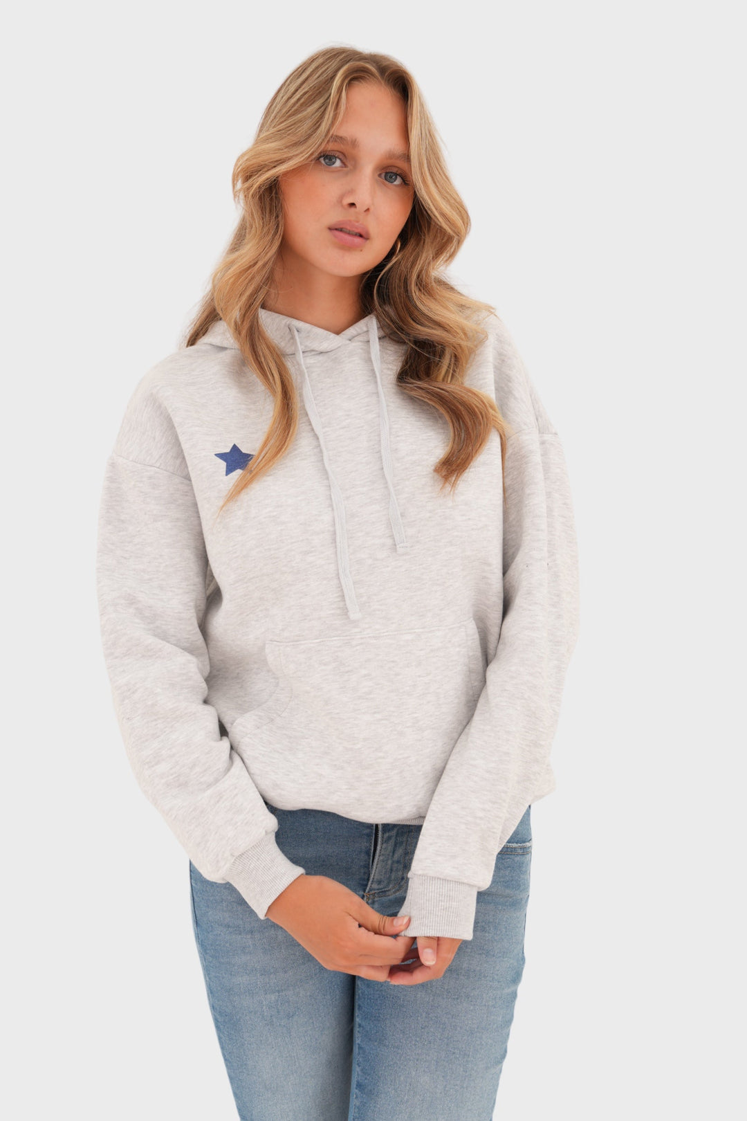 Versatile grey women's long-sleeve sweater featuring a playful star print. Relaxed fit for casual, comfortable wear.