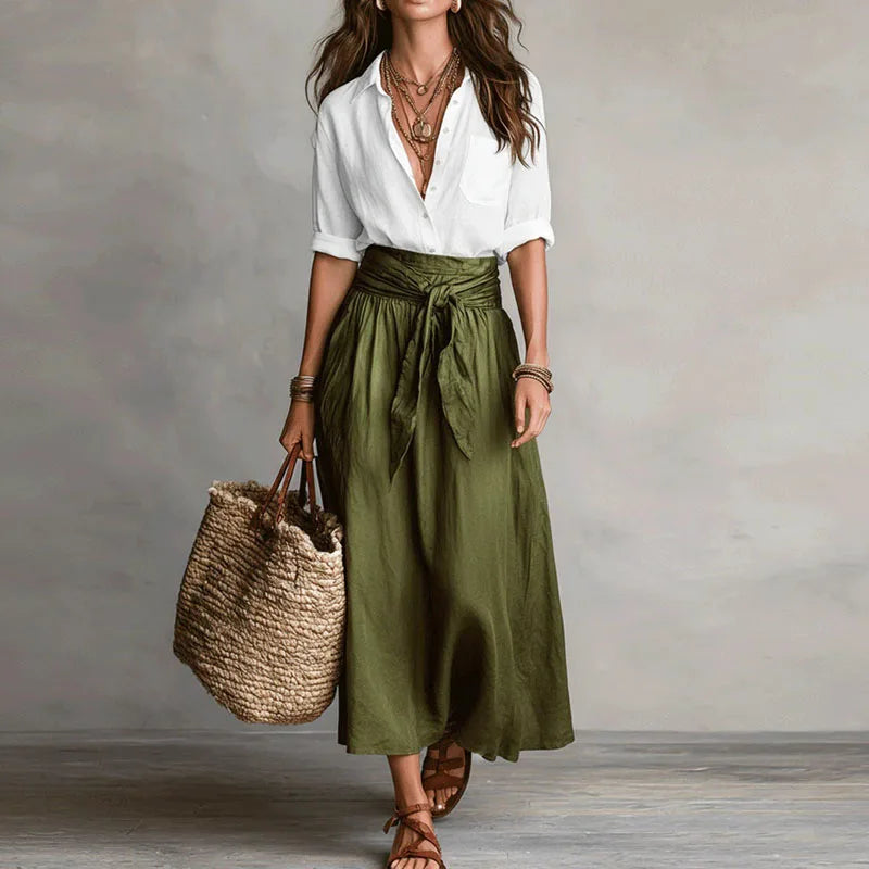 Jeanelle Women's Co-Ord skirt suit featuring a comfy long sleeve top & elegant tie-waist skirt. Casual/office wear.