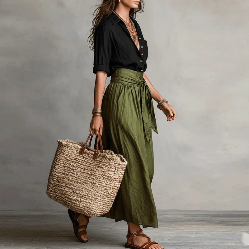 Chic Women's Jeanelle skirt suit. Long sleeve top and tie-waist skirt offer effortless style for casual or work.