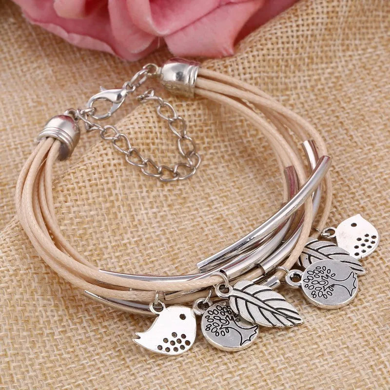 Stylish women's layered beige leather multi-strand bracelet, a modern fashion accessory.