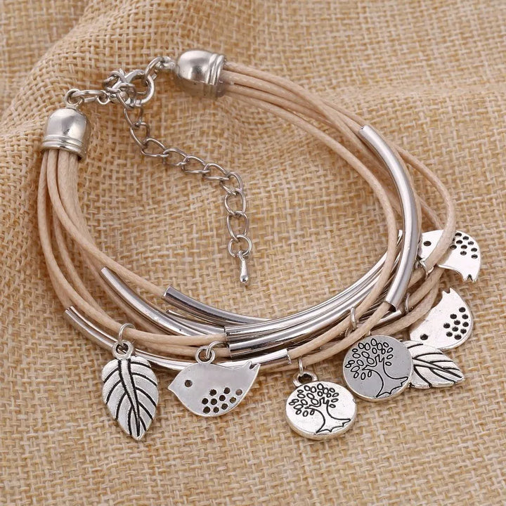 Natural beige leather multi-strand bracelet, layered women's jewelry & trendy fashion accessory.