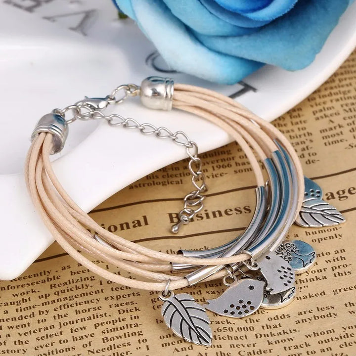 White multi-strand women's bracelet, natural layered leather design with magnetic clasp.