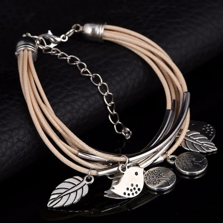 Women's gray multi-strand natural leather bracelet, an adjustable layered fashion accessory.