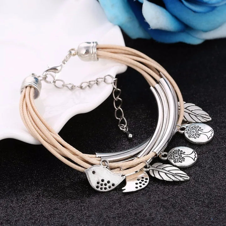 Stylish white layered leather bracelet, multi-strand women's jewelry with a secure clasp.