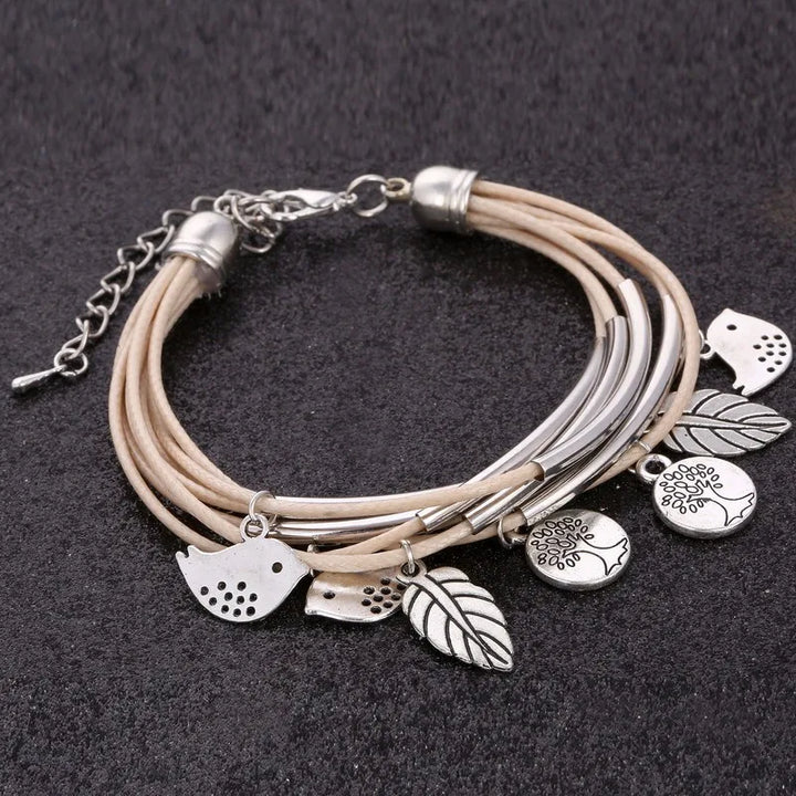 Close-up of beige multi-strand layered leather bracelet for women, a charming fashion piece.