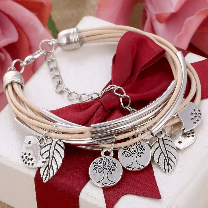 Women's gray layered multi-strand leather bracelet, a versatile and adjustable fashion accessory.