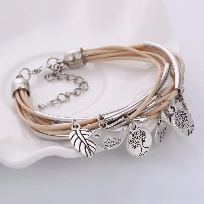 White natural leather multi-strand bracelet, layered design, elegant women's jewelry.