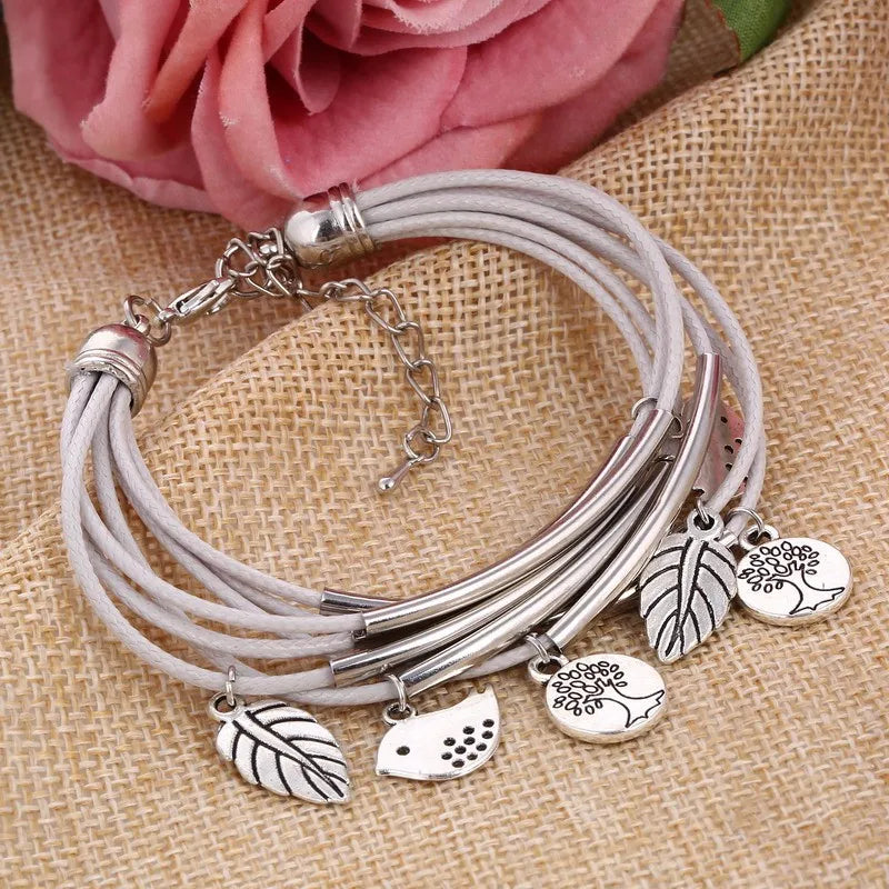 Women's beige multi-strand layered leather bracelet, a stylish and comfortable fashion accessory.