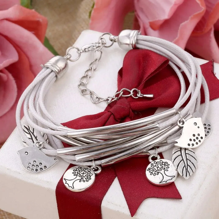 Adjustable gray layered leather bracelet for women, multi-strand design with magnetic clasp.