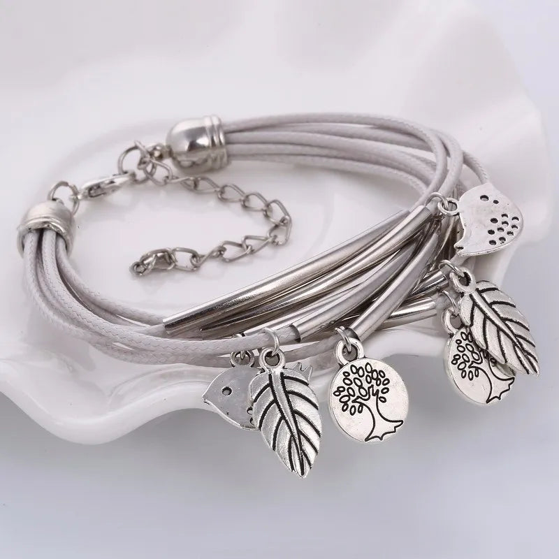 White multi-strand layered leather bracelet, women's elegant fashion accessory.
