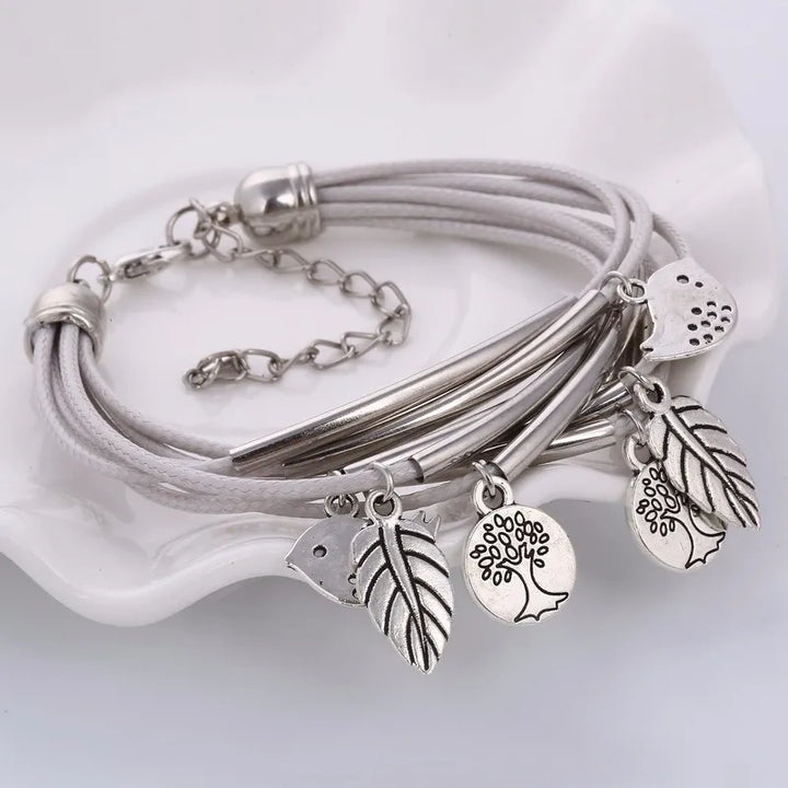 White multi-strand layered leather bracelet, women's elegant fashion accessory.