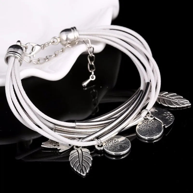 White layered leather multi-strand bracelet for women, a trendy adjustable fashion accessory.