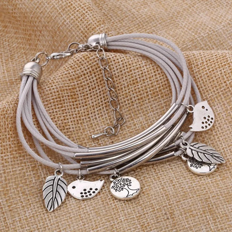 Chic white layered leather bracelet for women, an adjustable multi-strand fashion accessory.
