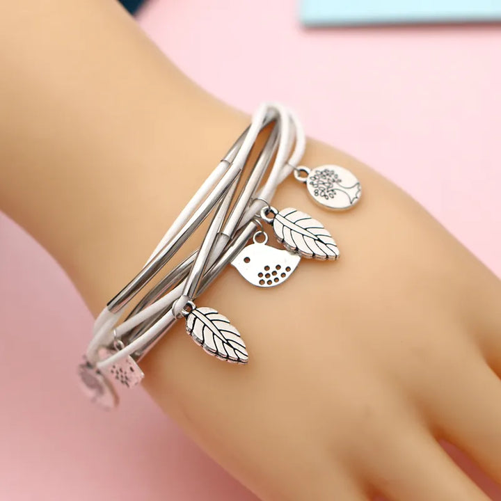 Close-up of a beige multi-strand natural leather bracelet, women's jewelry with magnetic clasp.