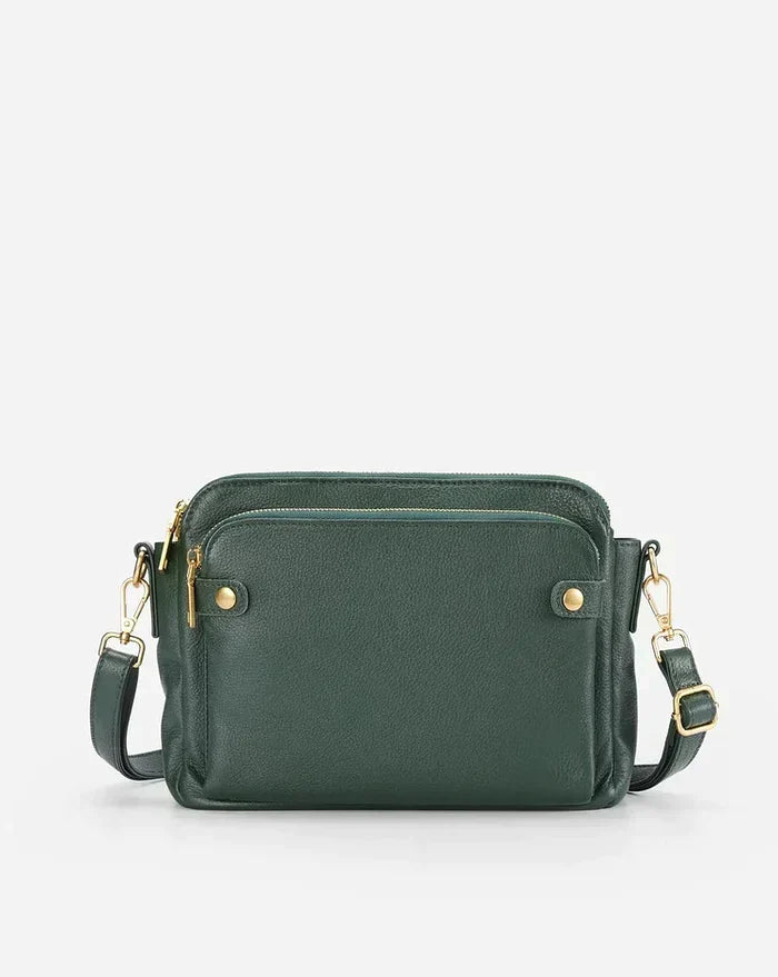 Spacious women's leather crossbody bag, ideal for daily use & hands-free convenience.