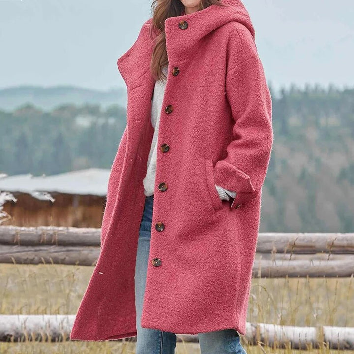 Cozy women's long hooded winter coat, essential stylish outerwear for cold weather comfort.