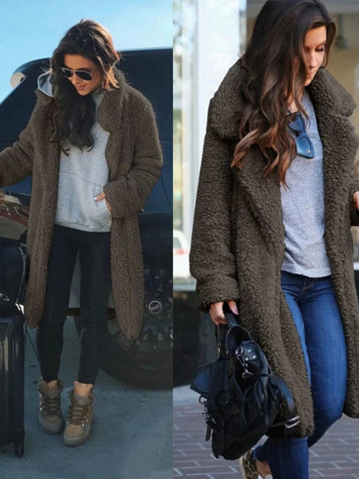 Elegant women's long teddy coat, warm teddy material, a fashionable and cozy winter outerwear piece.