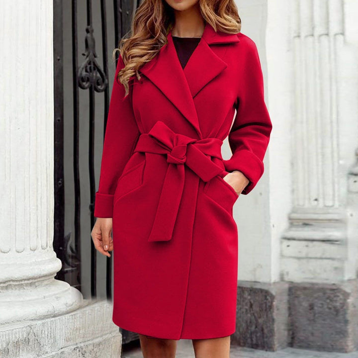 Full-length women's long trench coat. A stylish and warm winter jacket, essential elegant outerwear.