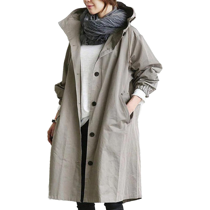 Fashionable women's long rain jacket, waterproof & windproof, designed for ultimate dryness and modern style.