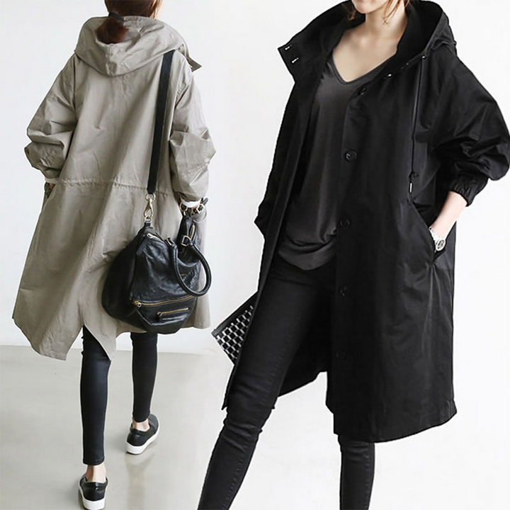 Women's long waterproof & windproof rain jacket, an elegant essential for staying dry and stylish on rainy days.