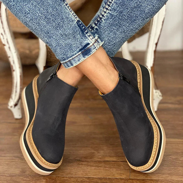 Versatile women's low ankle boots with convenient side zipper, great for casual or dressy outfits.