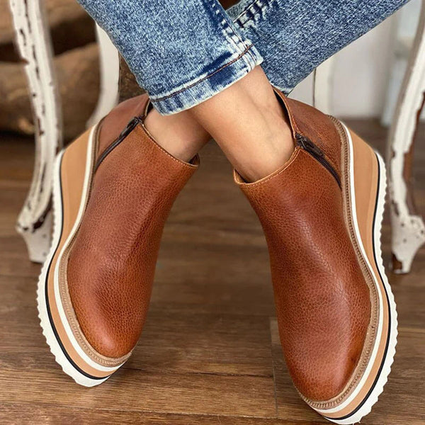 Fashionable women's low ankle boots, offering stylish comfort for any occasion, from casual to dress.