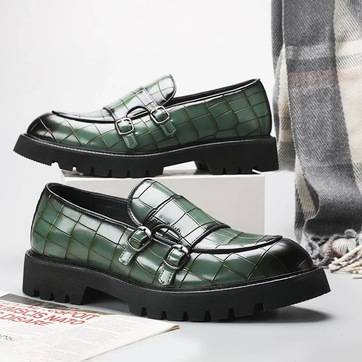 Comfortable black platform loafers for women, featuring a slip-on design & embossed details.