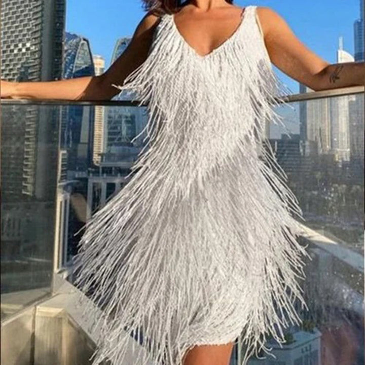 Fashionable printed mini dress for women featuring decorative tassels, ideal for a stylish party look.