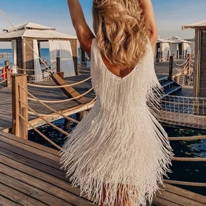 Versatile women's mini dress adorned with charming tassels, suitable for elegant dinners and casual outings.