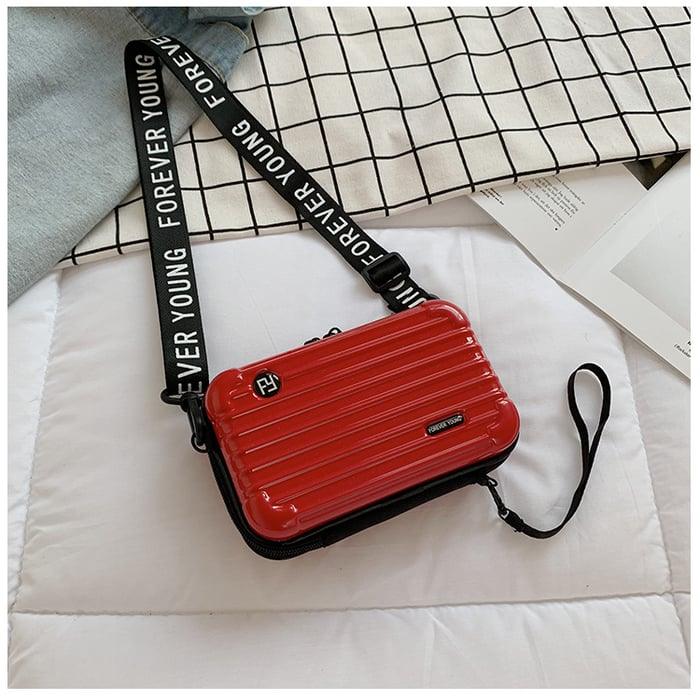 Stylish women's mini travel bag, compact polyester crossbody for daily carry & weekend getaways.
