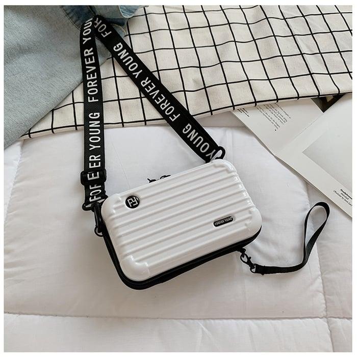 Elegant polyester mini bag for women, a stylish & functional compact travel accessory.