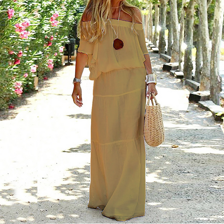 Stylish women's off-shoulder maxi dress, perfect for summer, beach vacations, or chic casual wear.