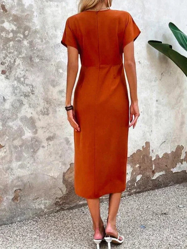 Chic orange V-neck midi dress for women, embodying summer elegance with a comfortable, flowing design.
