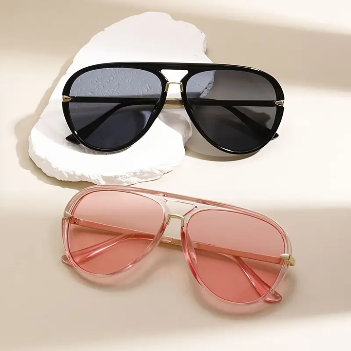 Stylish women's oversized aviator sunglasses. Fashionable eyewear with UV protection, perfect for summer.