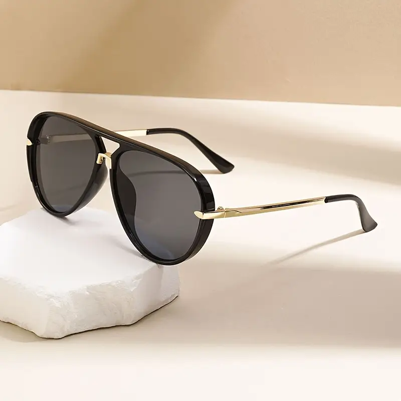 Women's oversized aviator sunglasses offering excellent UV protection. Trendy summer fashion accessory.
