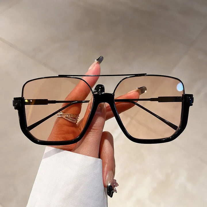 Stylish women's oversized square frame sunglasses with UV protection. Trendy fashion accessory eyewear.