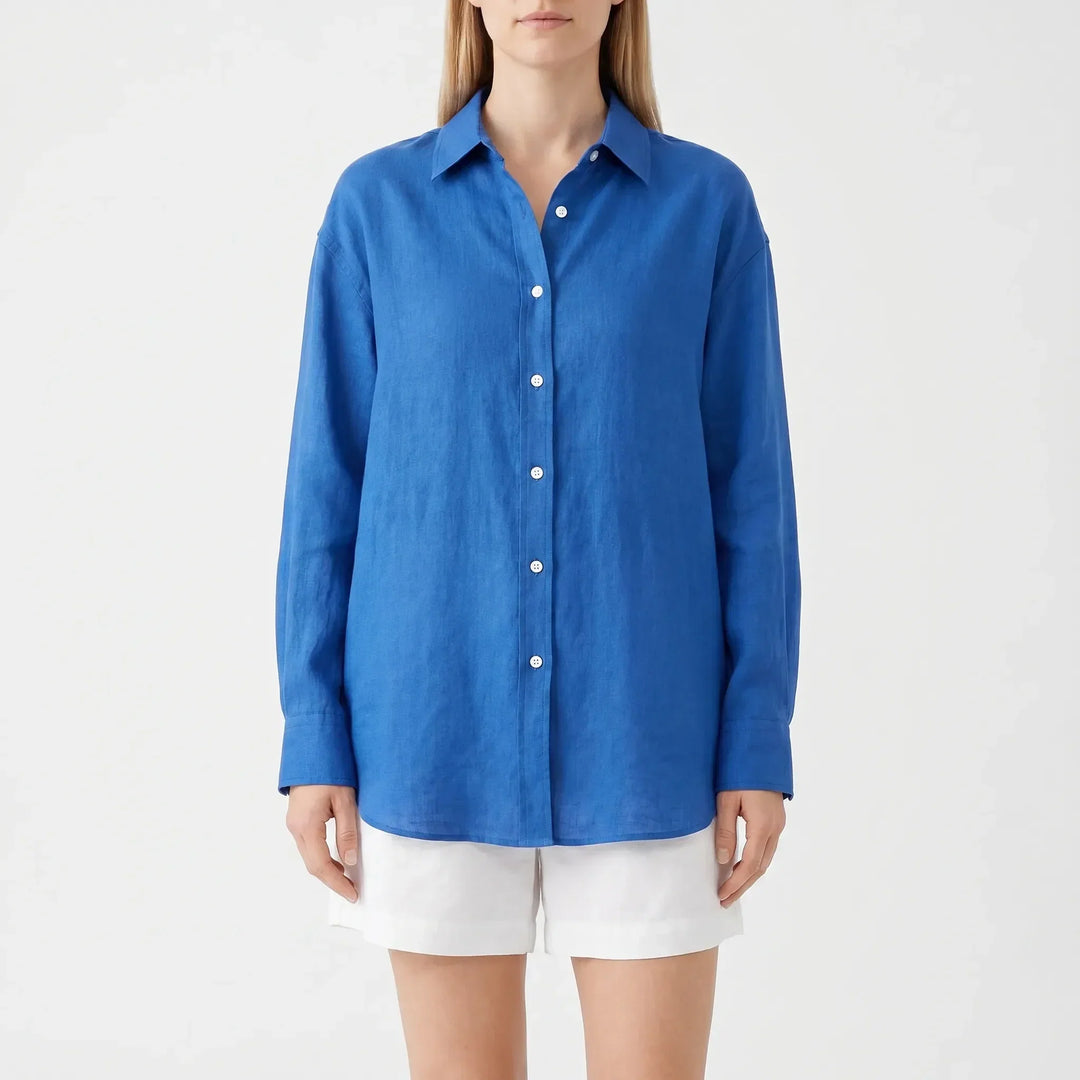 Women's collared button-up blouse with long sleeves and chest pocket, an effortless oversized summer top.