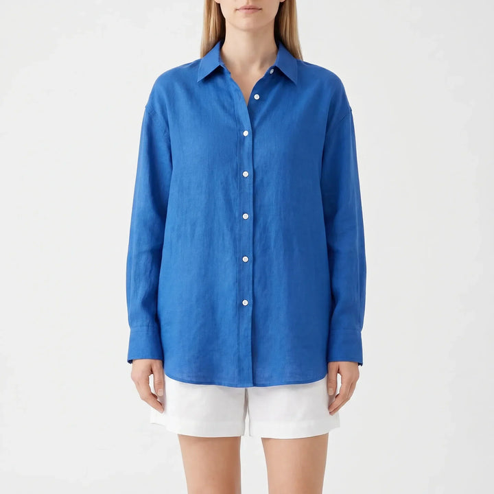 Women's collared button-up blouse with long sleeves and chest pocket, an effortless oversized summer top.
