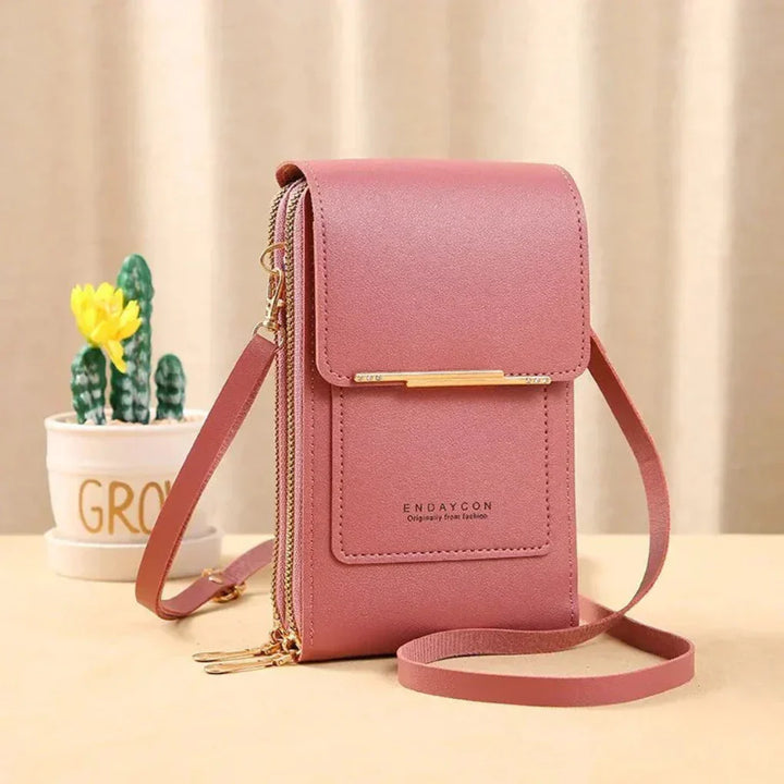 Compact black touchscreen phone crossbody bag for women. Keep your smartphone safe & accessible on the go.