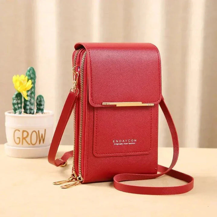 Hands-free women's travel crossbody bag with a dedicated touchscreen phone pocket. Stay organized & stylish.