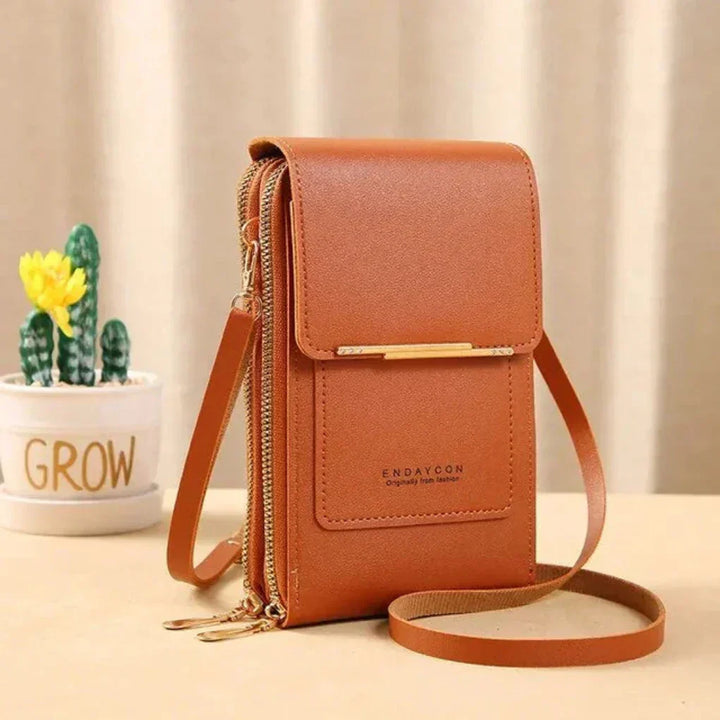 Organizer women's phone crossbody bag in a vibrant color, featuring an external touchscreen pocket for quick access.