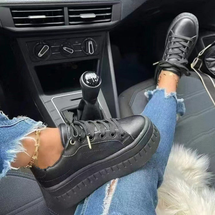 Modern women's platform sneakers featuring a chunky sole. Comfortable & stylish footwear for everyday fashion.