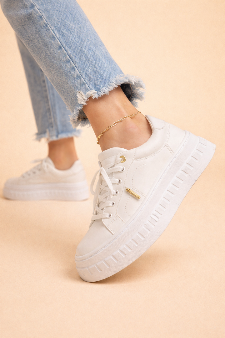 Elevated women's platform sneakers, featuring a chunky sole and cushioned design for stylish comfort.