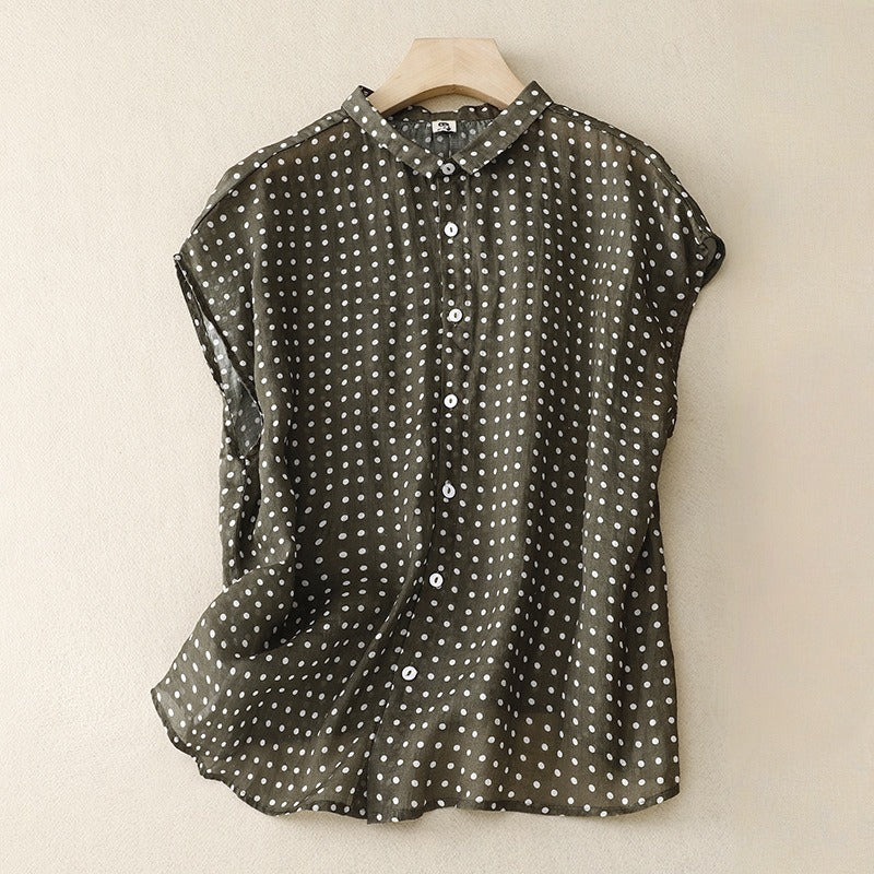 Stylish women's polka dot short sleeve top. Perfect for casual summer fashion, offering comfort and chic style.