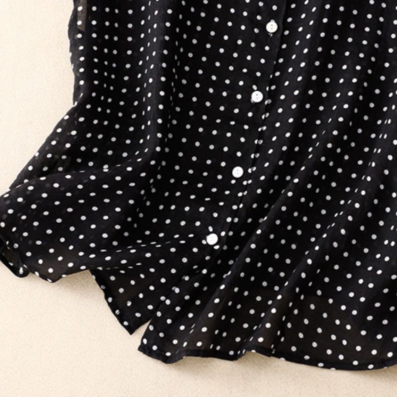 Fashionable women's green polka dot short sleeve top. Effortless style for summer, a classic and elegant blouse.
