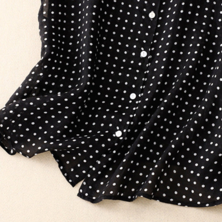 Fashionable women's green polka dot short sleeve top. Effortless style for summer, a classic and elegant blouse.