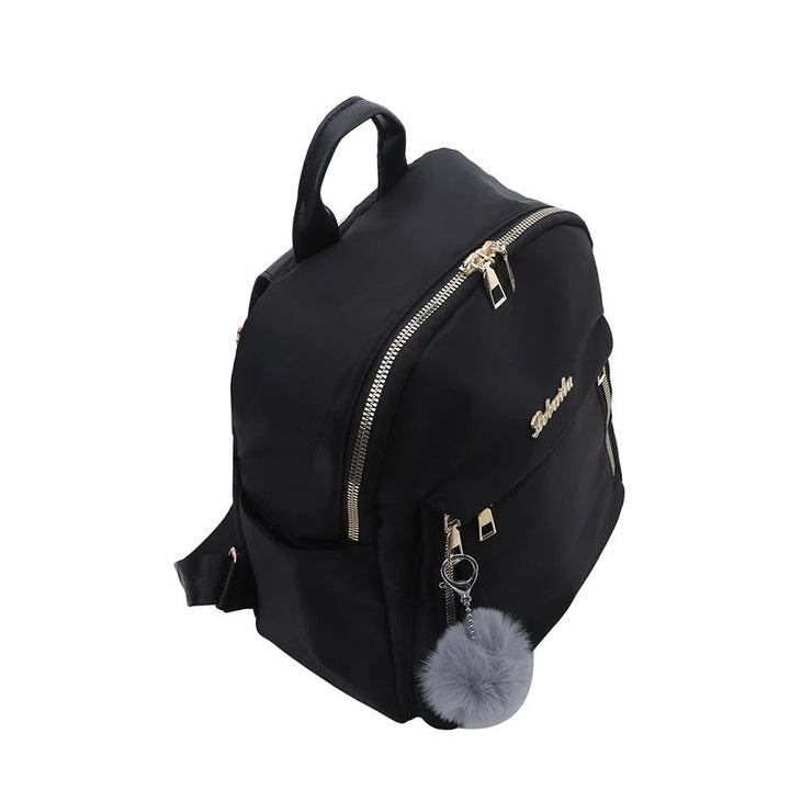 Fashionable woman carrying a black PU leather travel backpack, ideal for urban exploration & stylish outings.