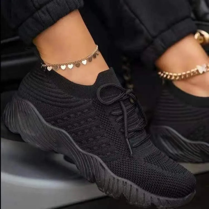Breathable chunky lace-up sneakers for women. Offers trendy style and summer comfort, perfect for casual fashion.