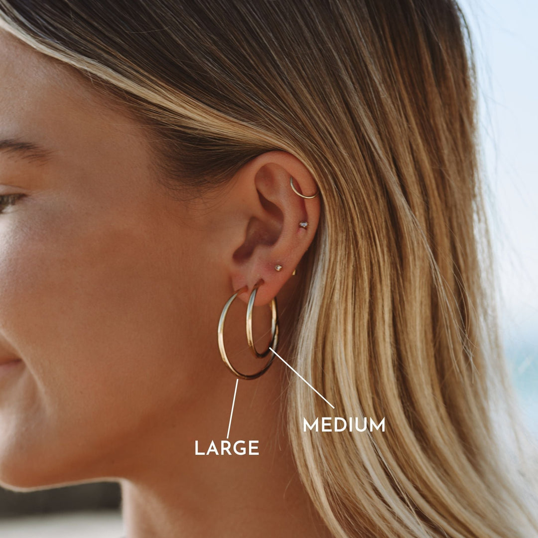 Elegant gold thin hoop earrings for women. Lightweight & stylish delicate hoops, ideal for daily wear.